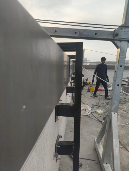 Stainless steel 3D letters mounted on a building facade in Chennai